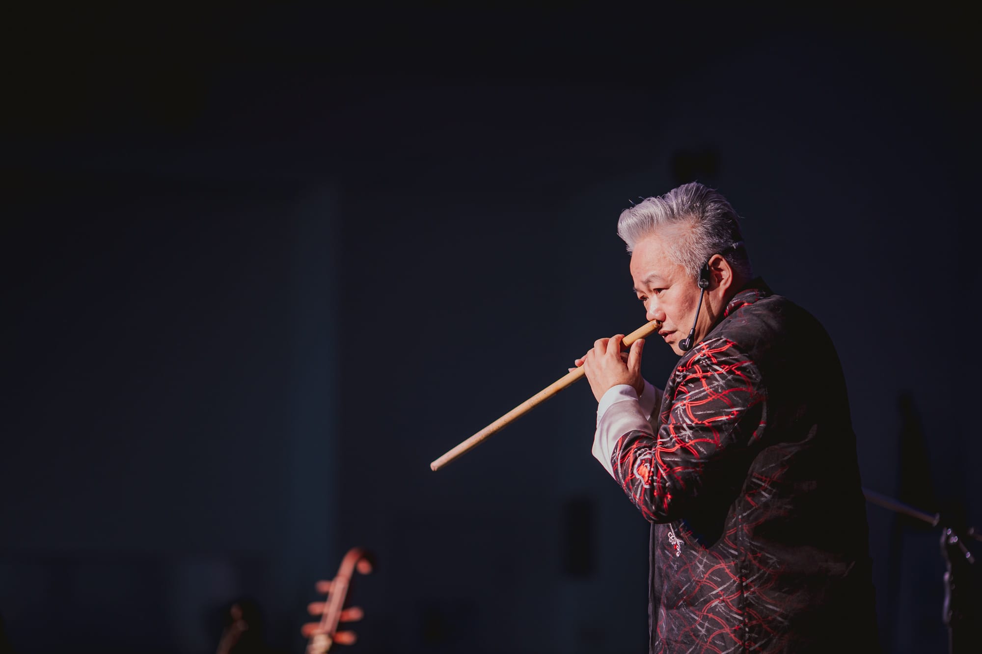 AISG Speaker Series with Fang Jinlong playing an instrument with his nose