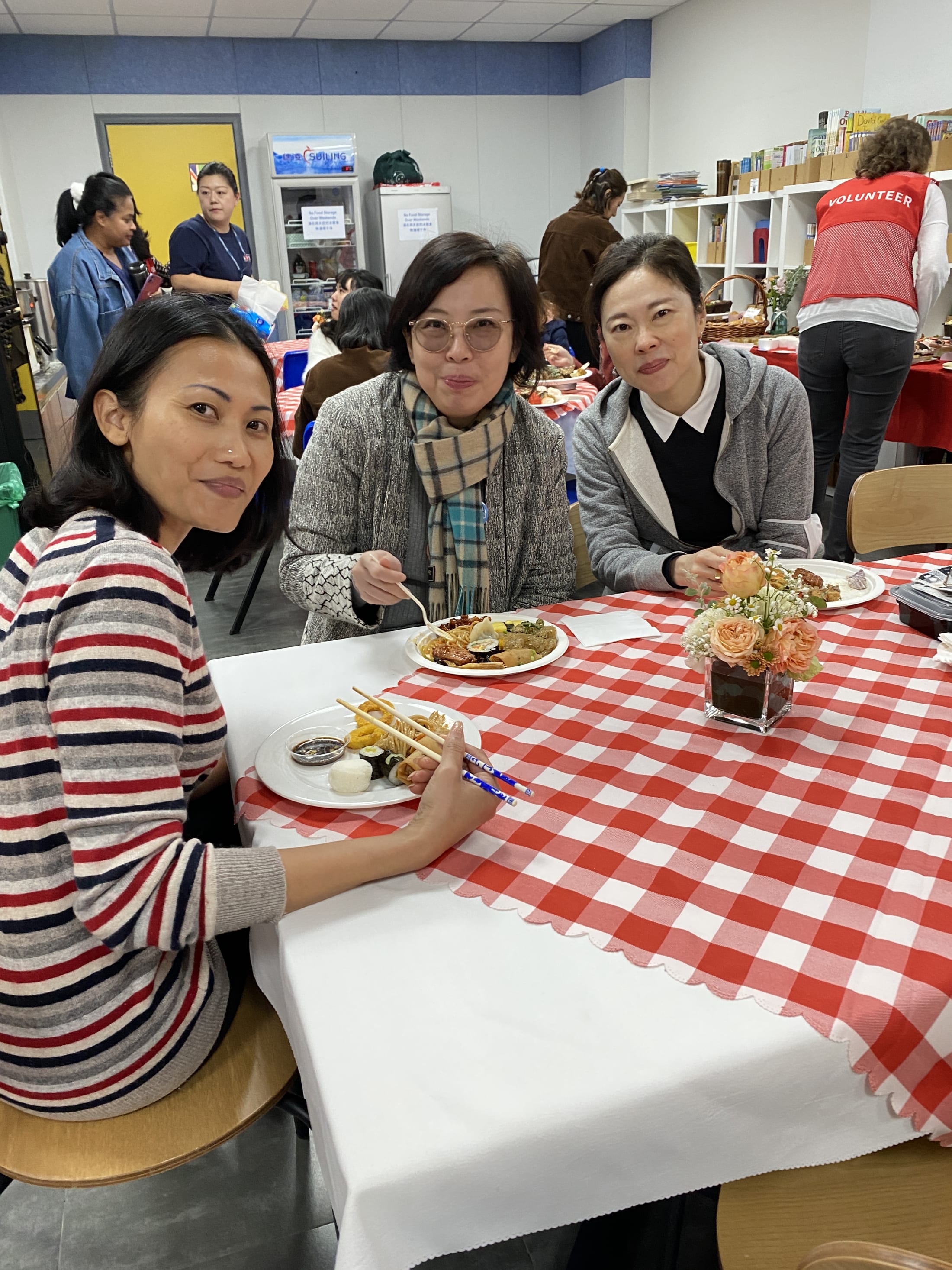 3 Elementary School faculty eating at the PTA Appreciation Lunch for AISG Faculty & Staff