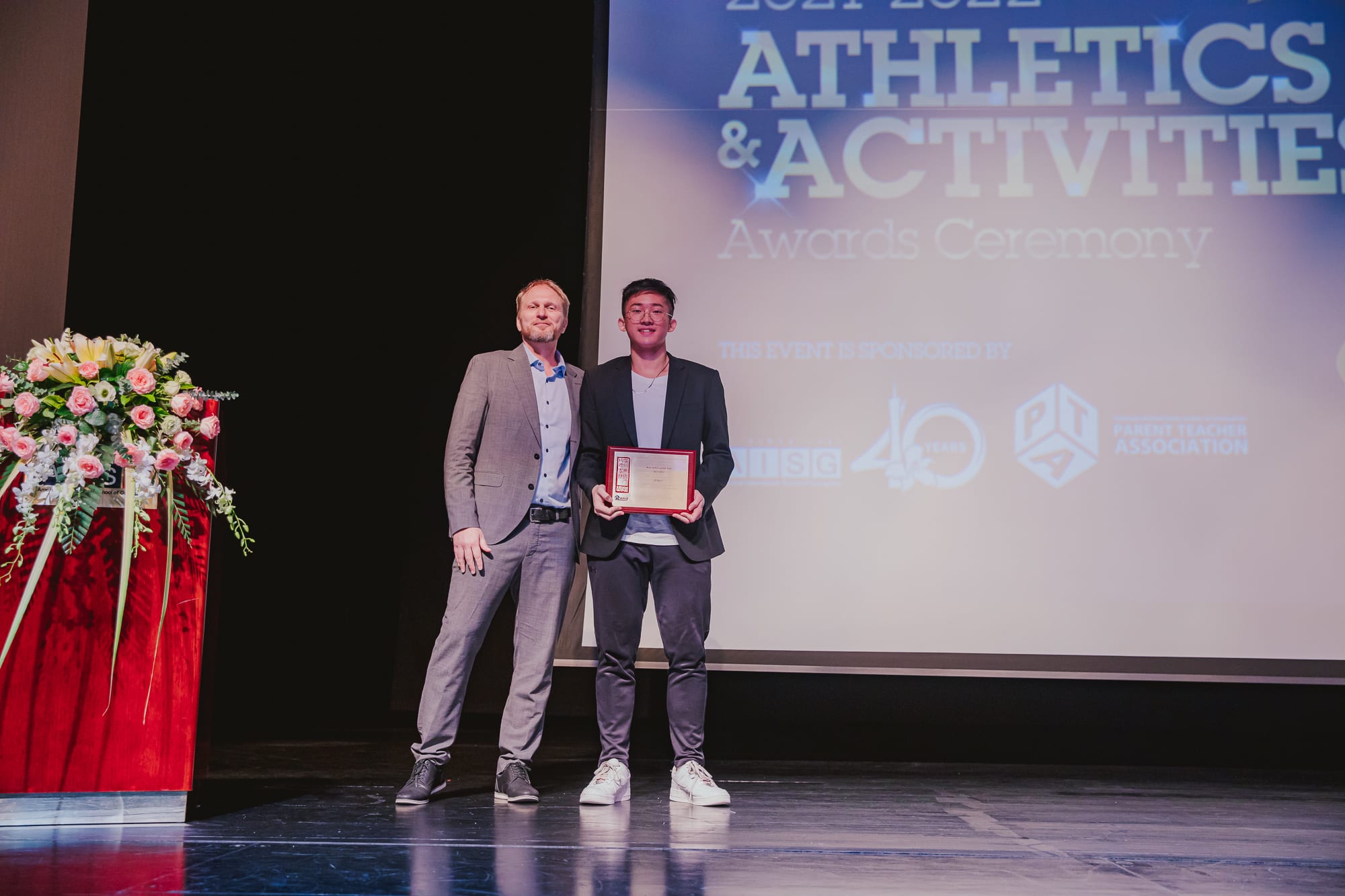 AISG Athletics & Activities Awards Ceremony presenting male athlete of the year award