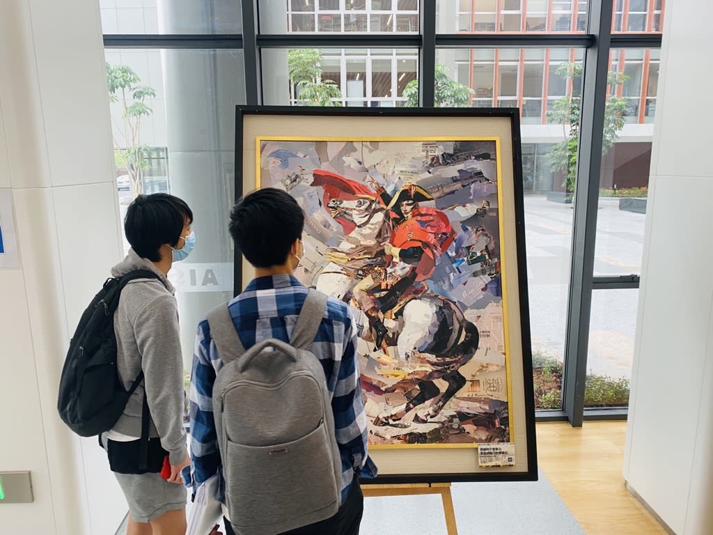 students look at painting