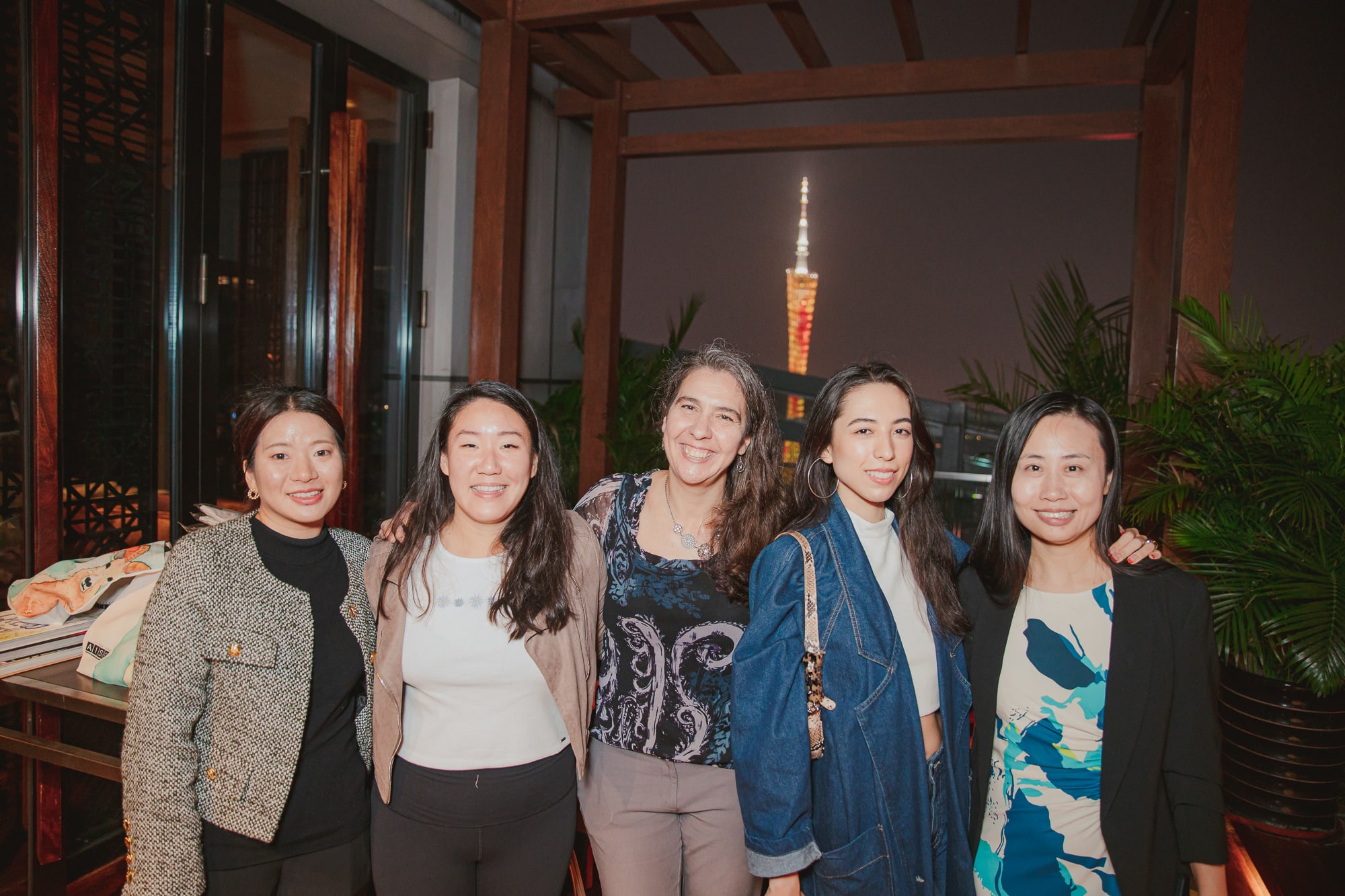 AISG alumni with AISG staff in an alumni Ram Gathering event with Canton Tower in the background