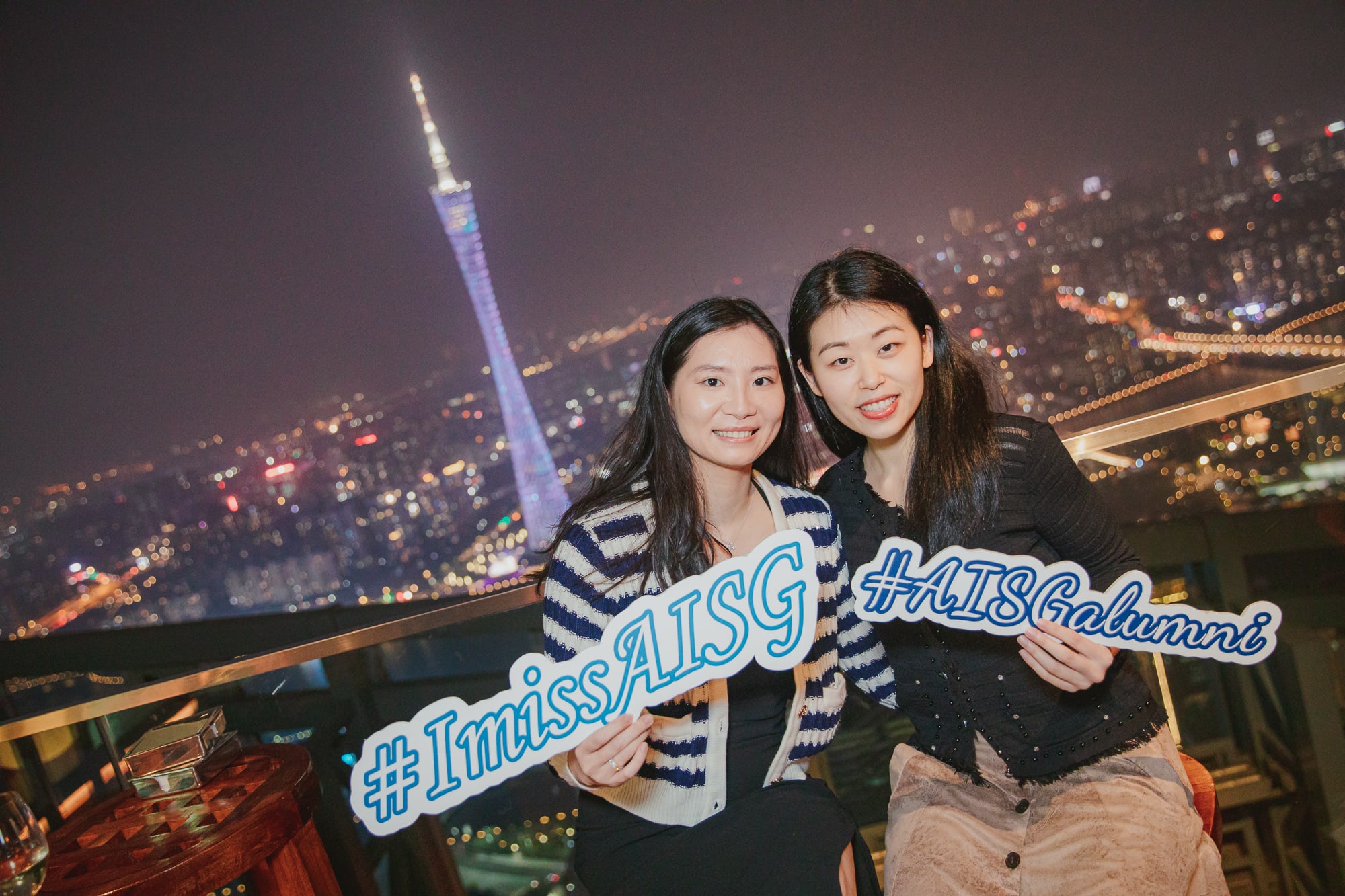 AISG alumni in an alumni Ram Gathering event with Canton Tower in the background