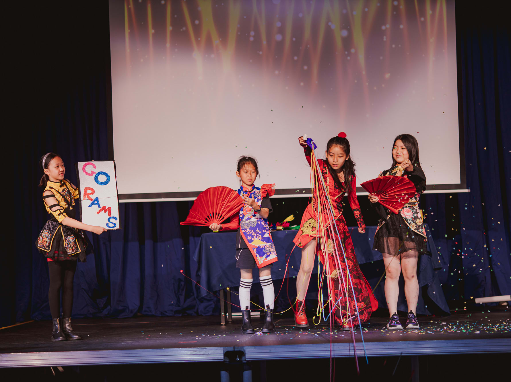 girls doing a chinese magic show