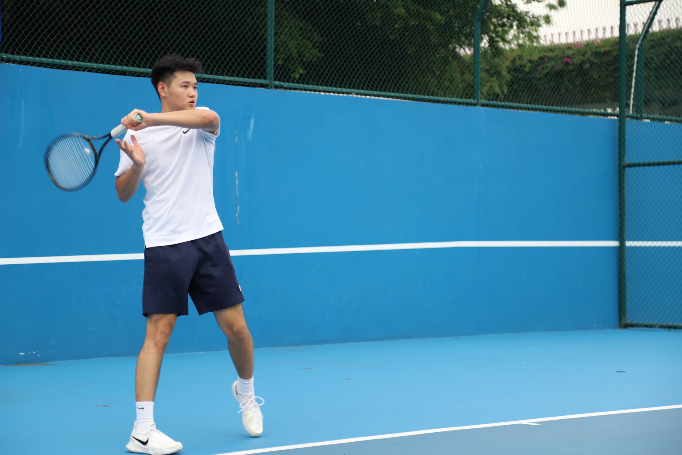 AISG student playing tennis
