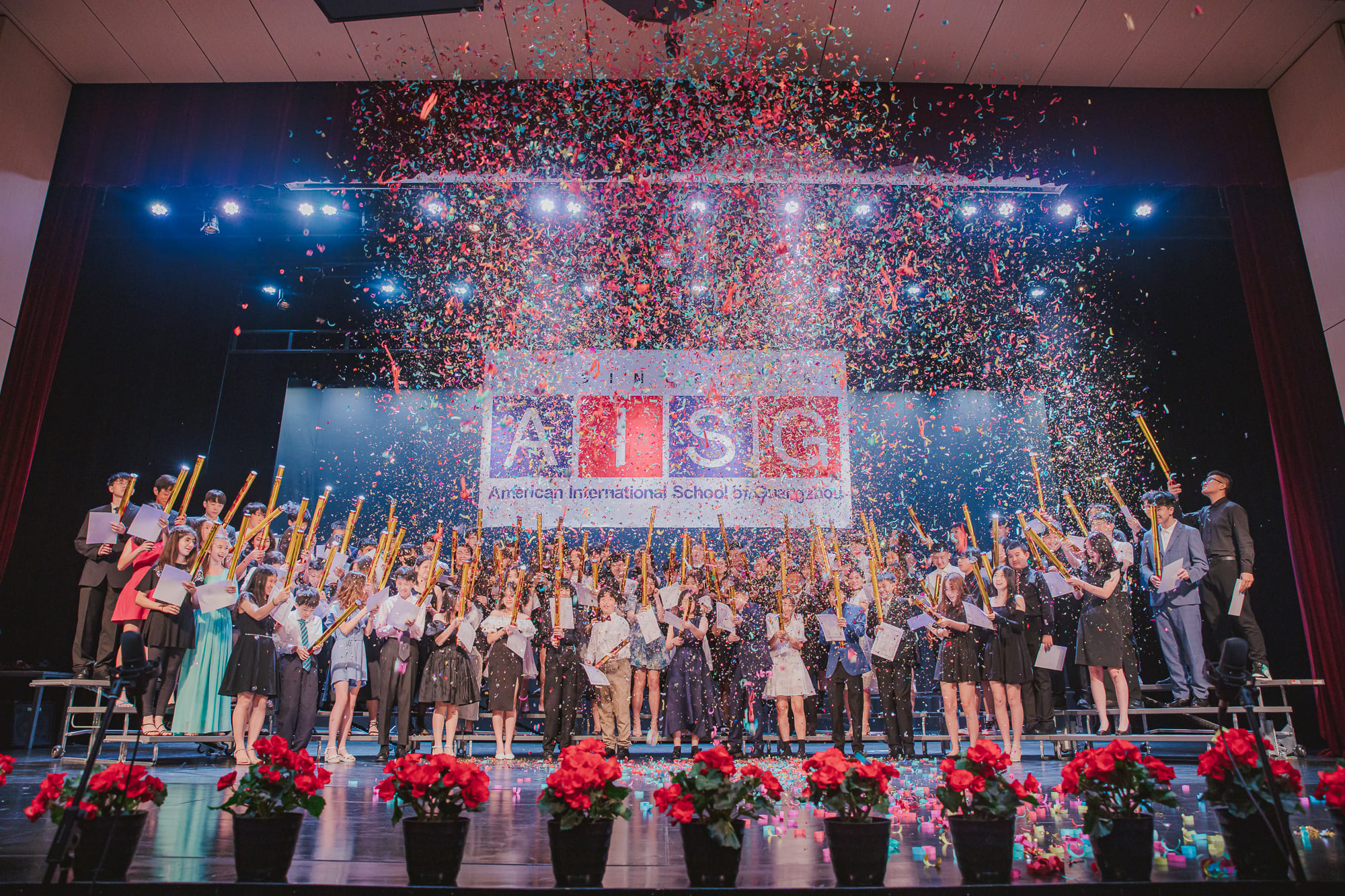 AISG Grade 8 Promotion students firing confetti