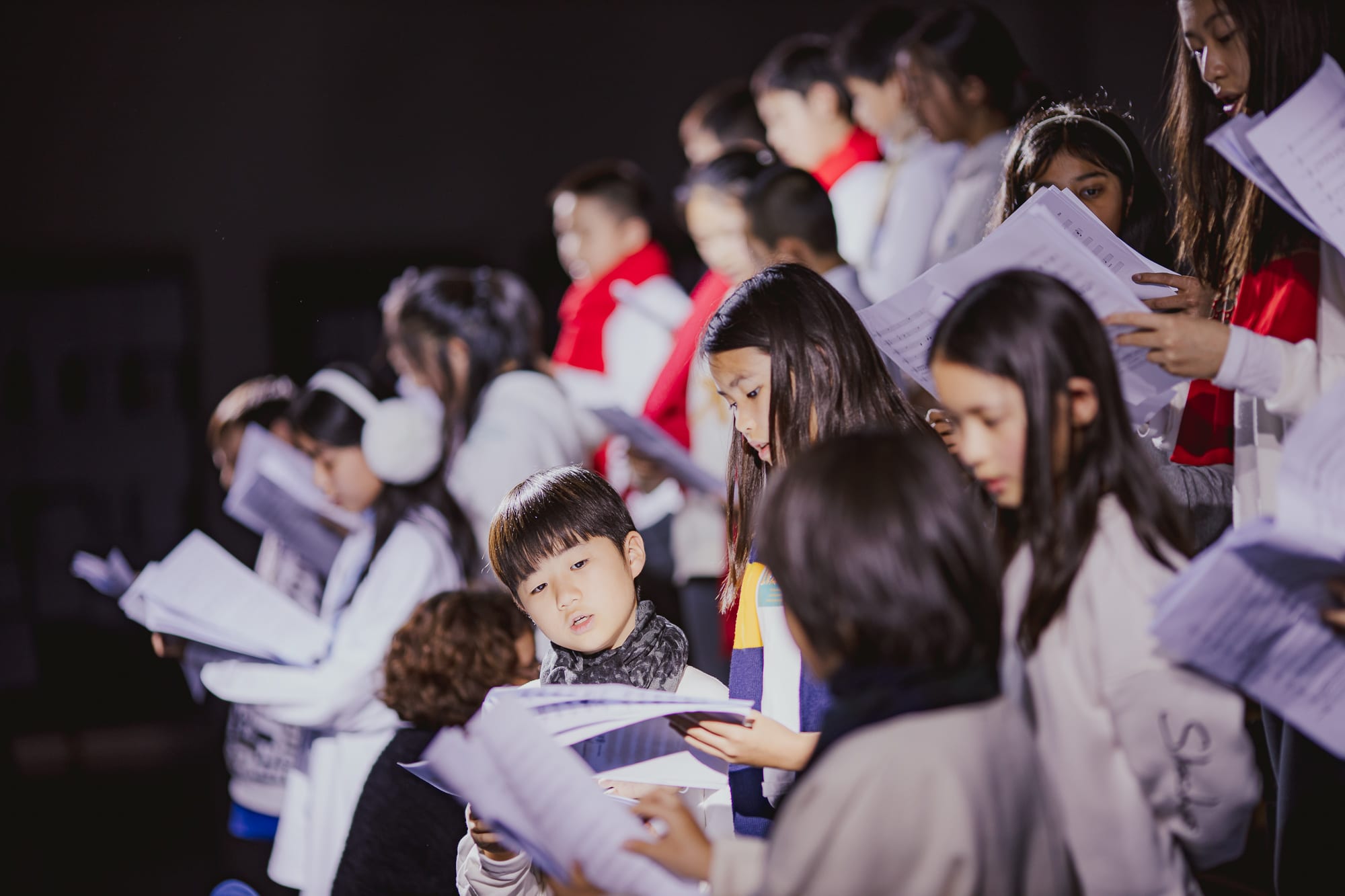 AISG elementary school students singing in a performance