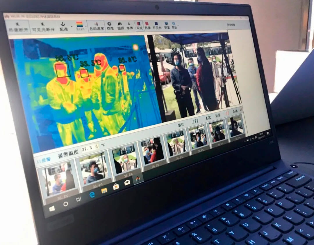 picture showing a laptop clearing people for access to campus