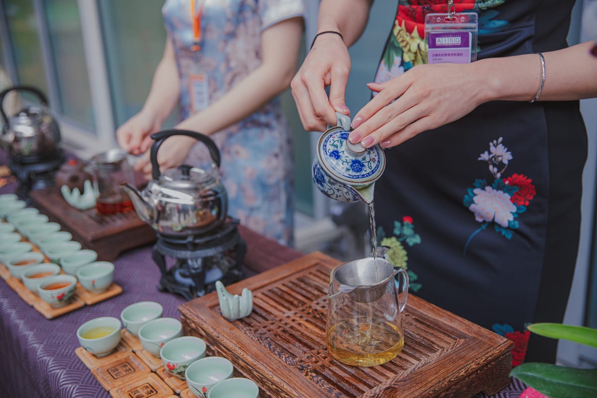 pouring tea from a pot