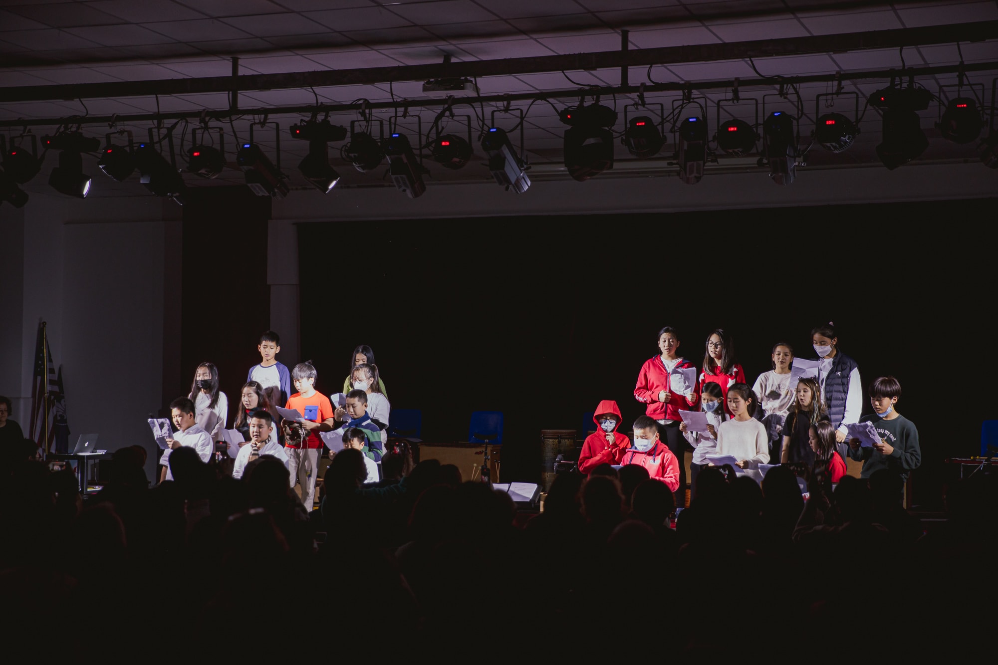 AISG elementary school students singing in a performance