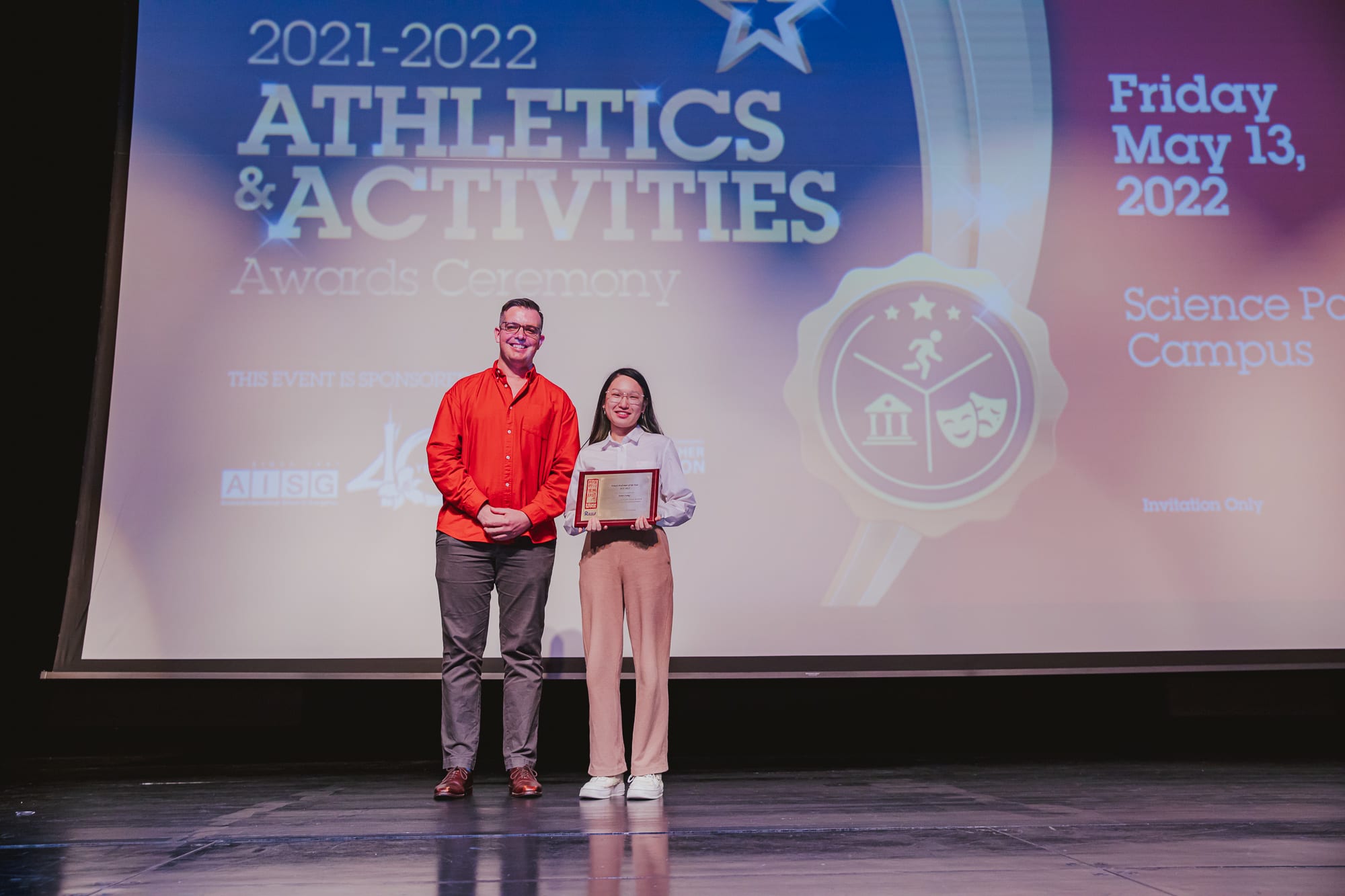 AISG Athletics & Activities Awards Ceremony presenting female performer of the year award