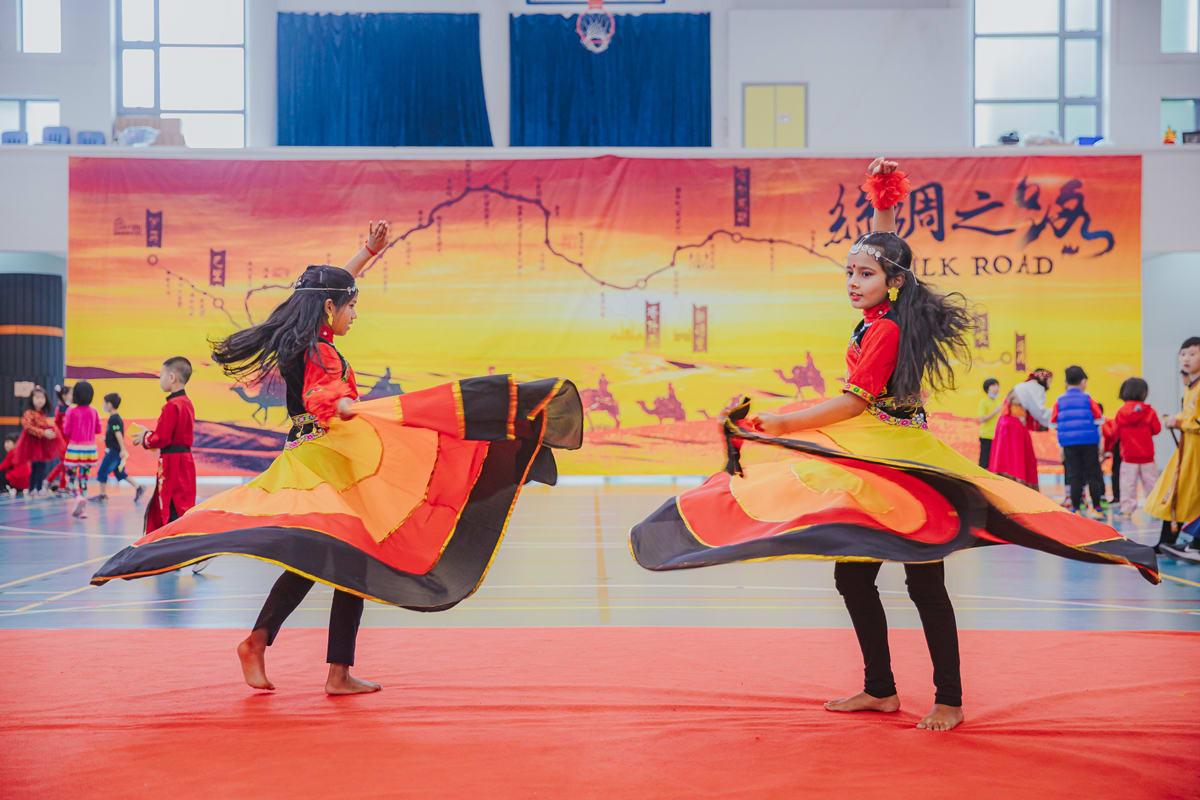 girls dancing in a performance at CNY