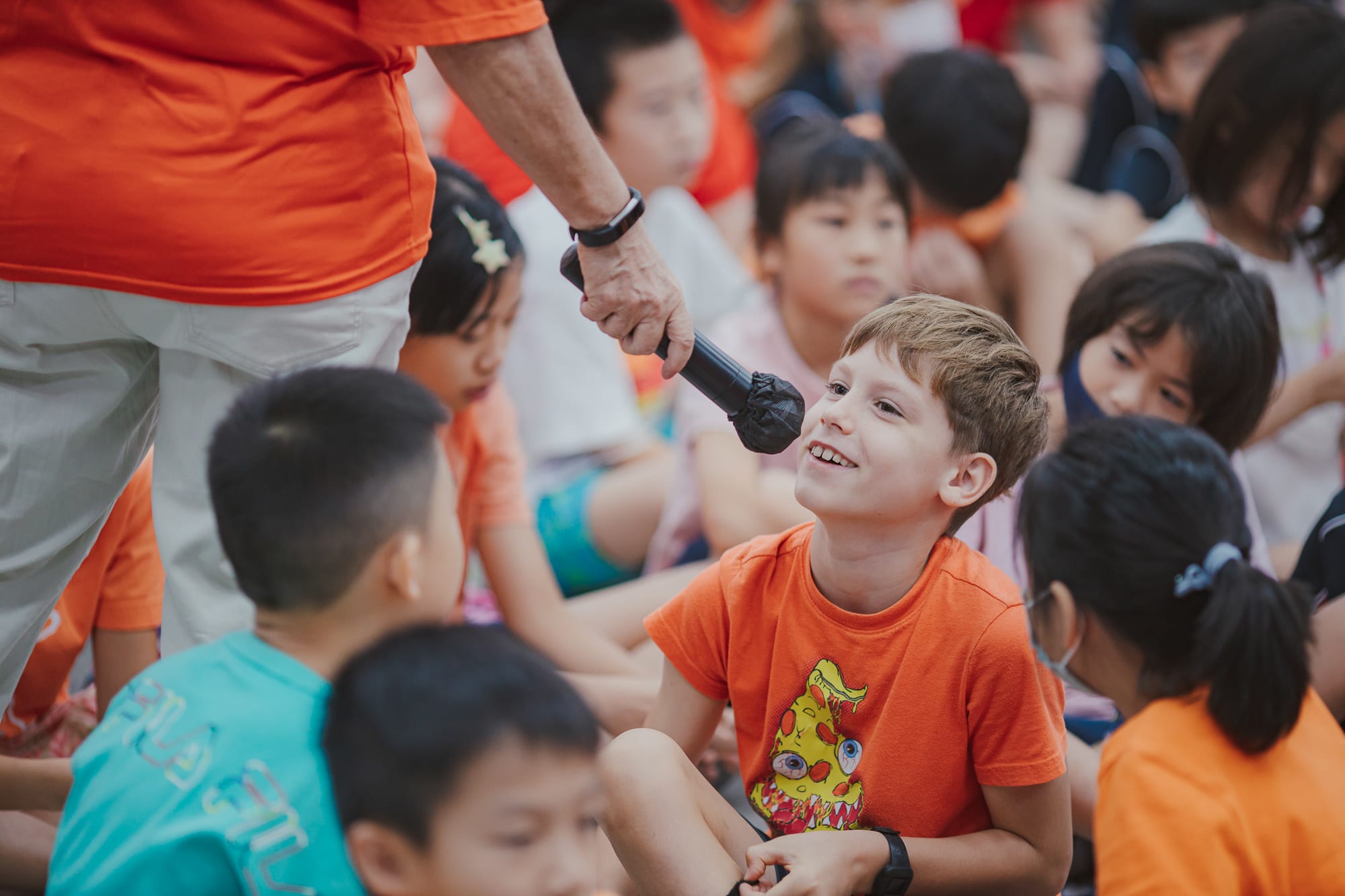 AISG Elementary School student on mic on the Upstander event