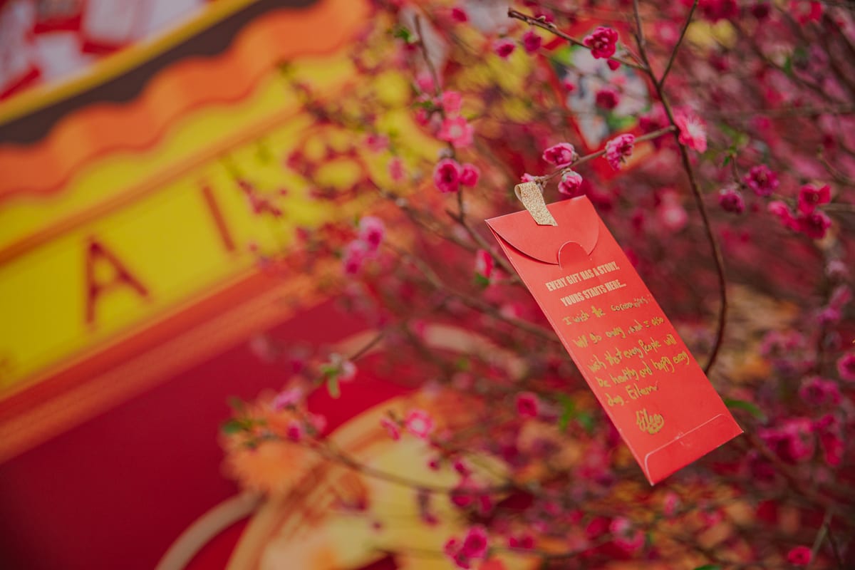 an envelope hangs on the giving tree