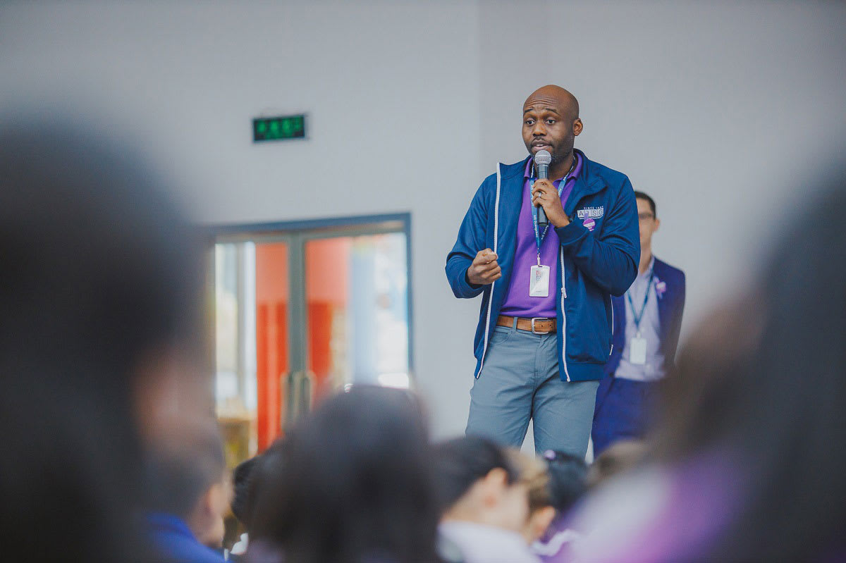 man speaking to students on how to stay safe